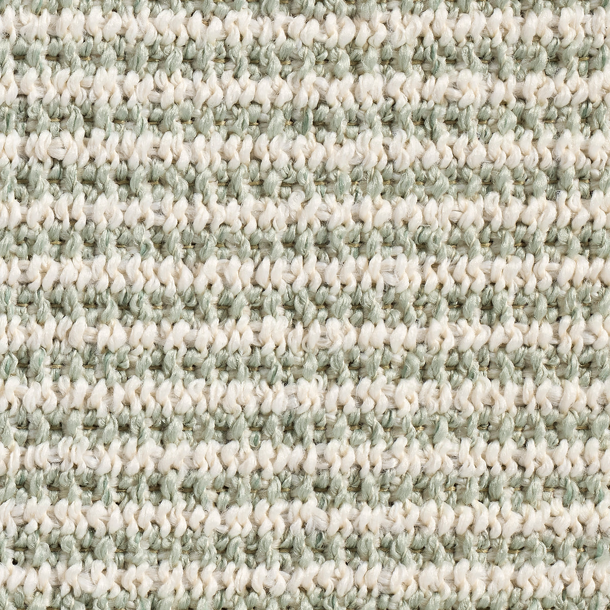 Close-up of a textured green and beige carpet