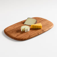 Serves Up Medium Cutting Board in Acacia - Angle 2