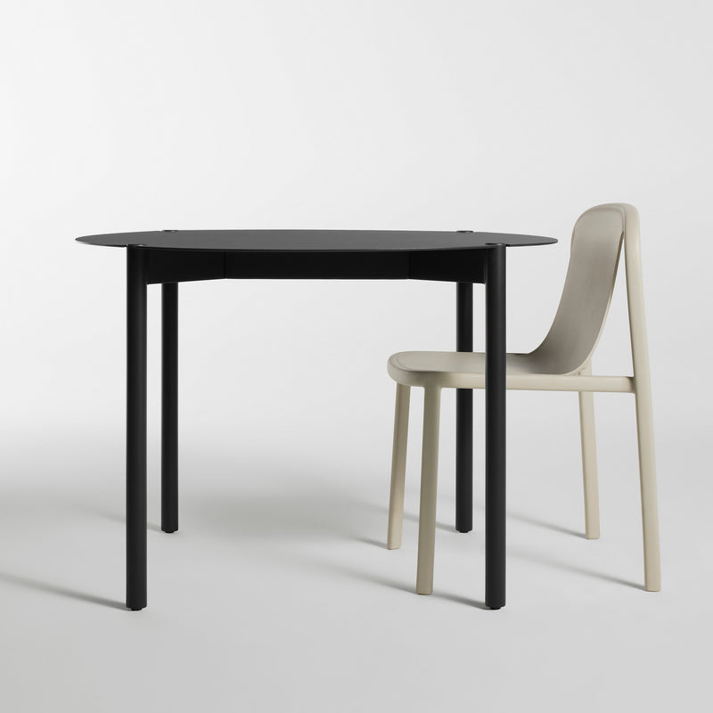 Comeuppance Round Dining Table in Oblivion - Angle 2