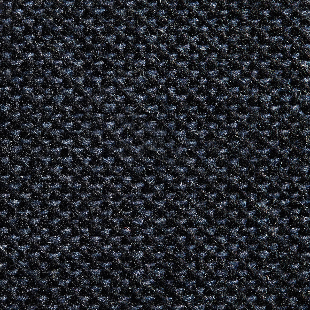 Close-up view of a navy blue fabric texture.
