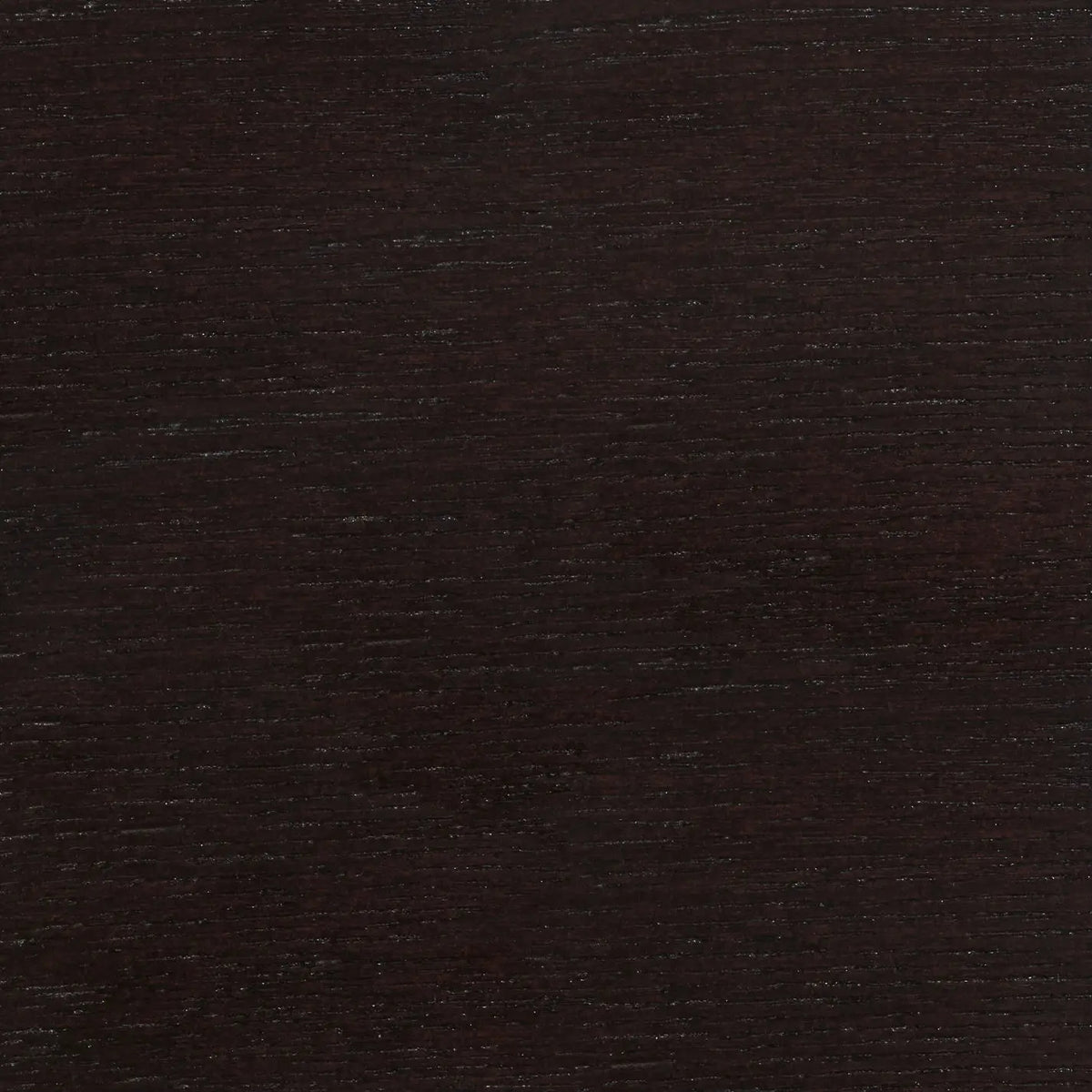 A close-up image of a black textured surface, possibly fabric or paper.