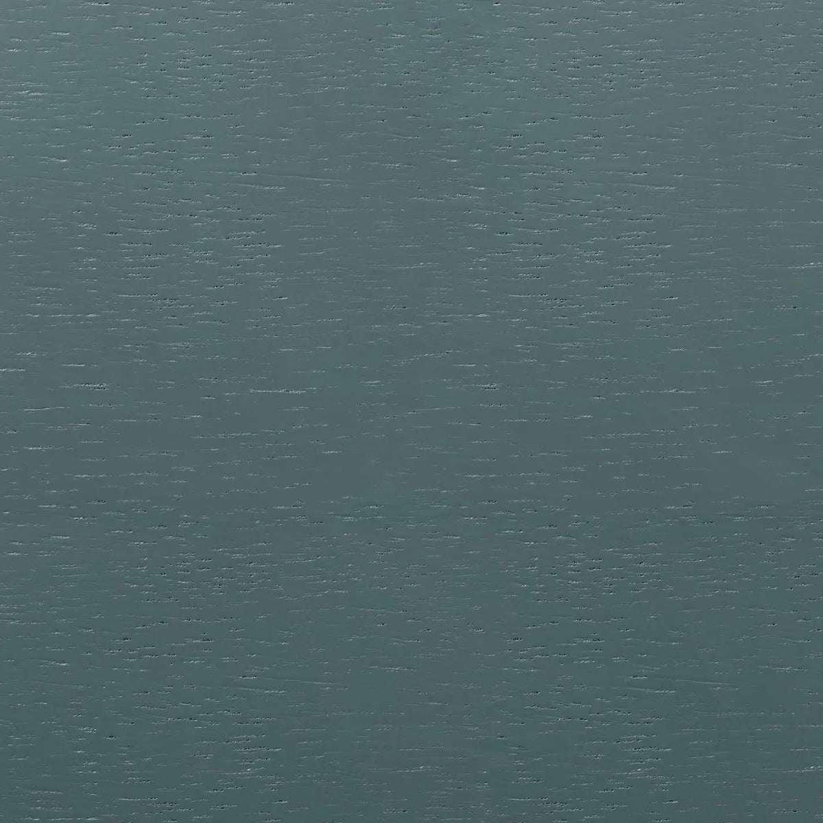 A close-up image of a textured marine blue material on an oak surface.