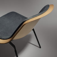 Nonesuch Upholstered Lounge Chair in White Oak / Ink Leather - Angle 4