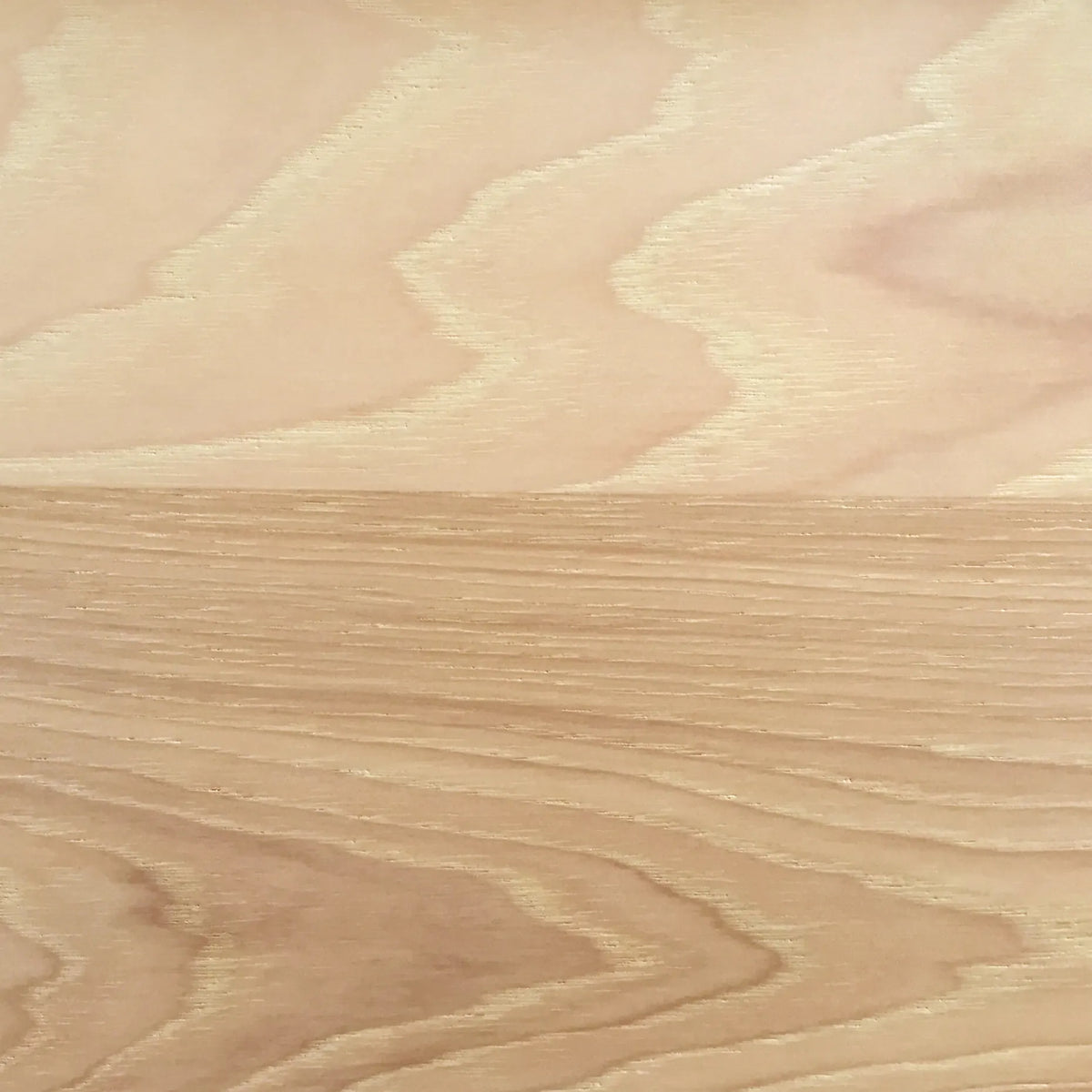Close-up view of a wooden surface with a natural hickory wood pattern.